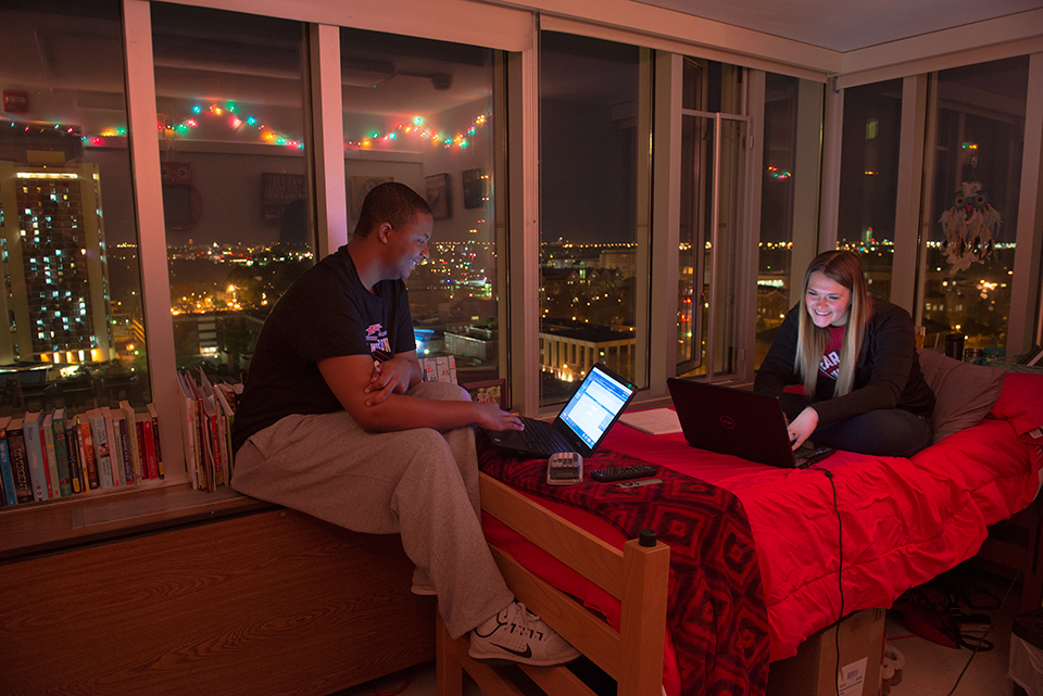 Single room in Manchester Hall overlooking Watterson Towers and the Quad at night.