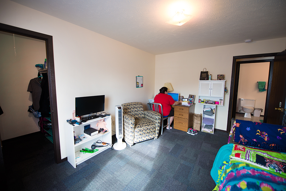 Room 1 facing entry and walk-in closet.