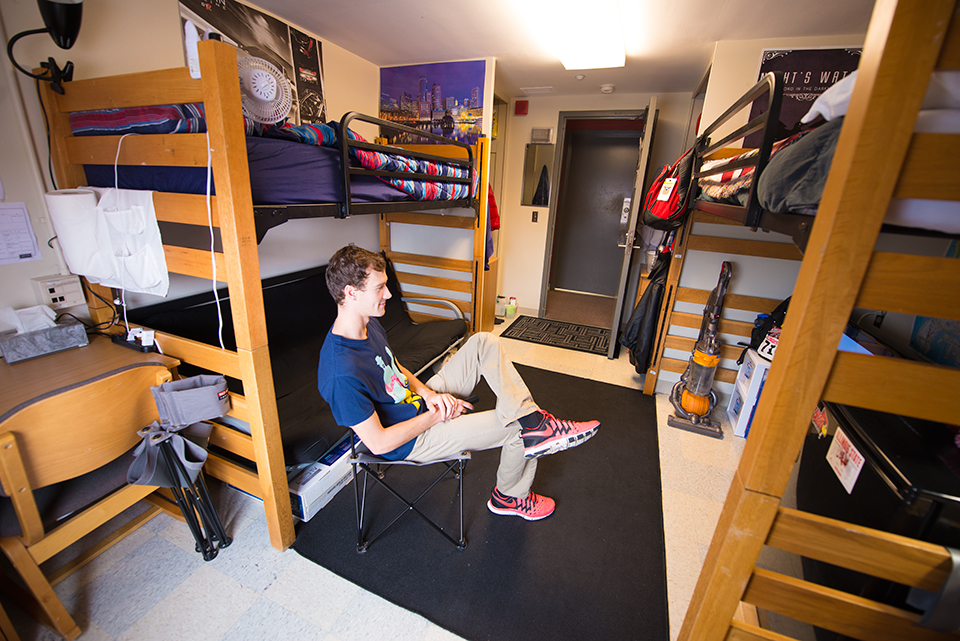 Double room in Haynie Hall with beds lofted facing entry.