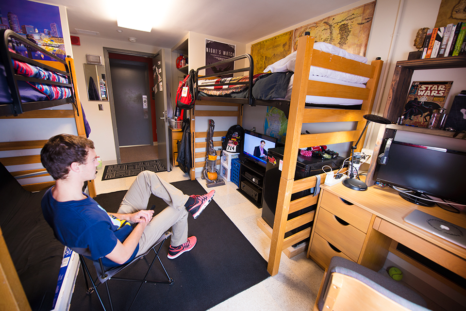Double room in Haynie Hall with beds lofted facing entry.