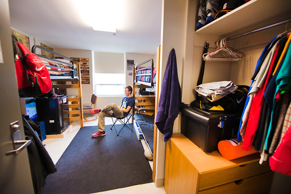 Double room in Haynie Hall with beds lofted facing window.